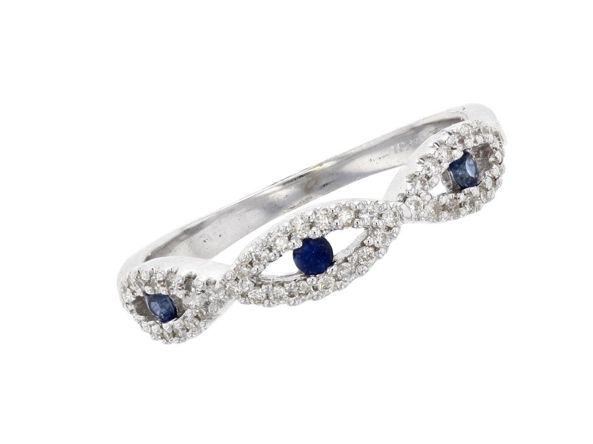 Elegant infinity ring with blue sapphires and diamond accents in 14K white gold, timeless fine jewelry