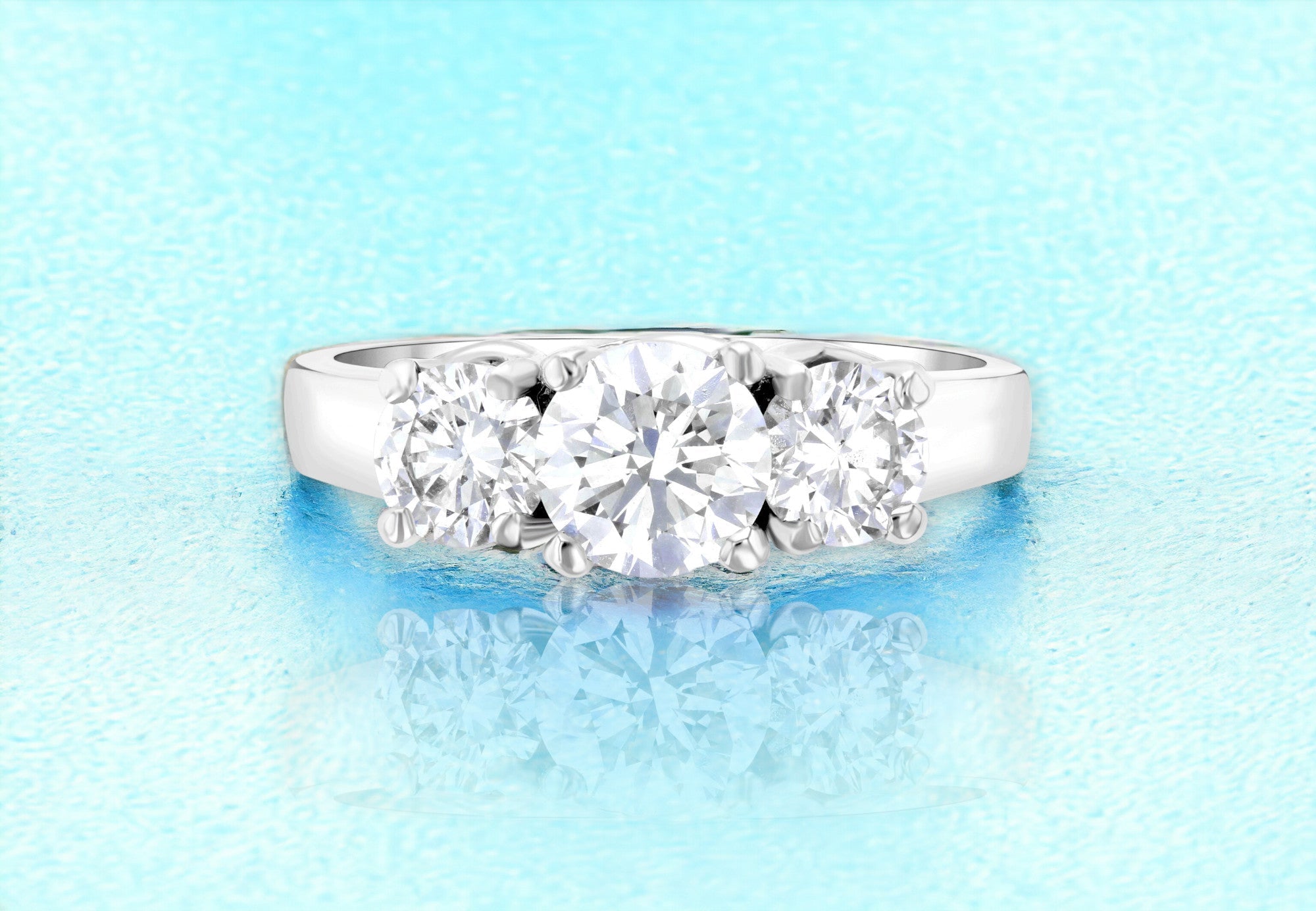 Three-stone diamond engagement ring in 14K white gold, timeless fine jewelry with brilliant round diamonds