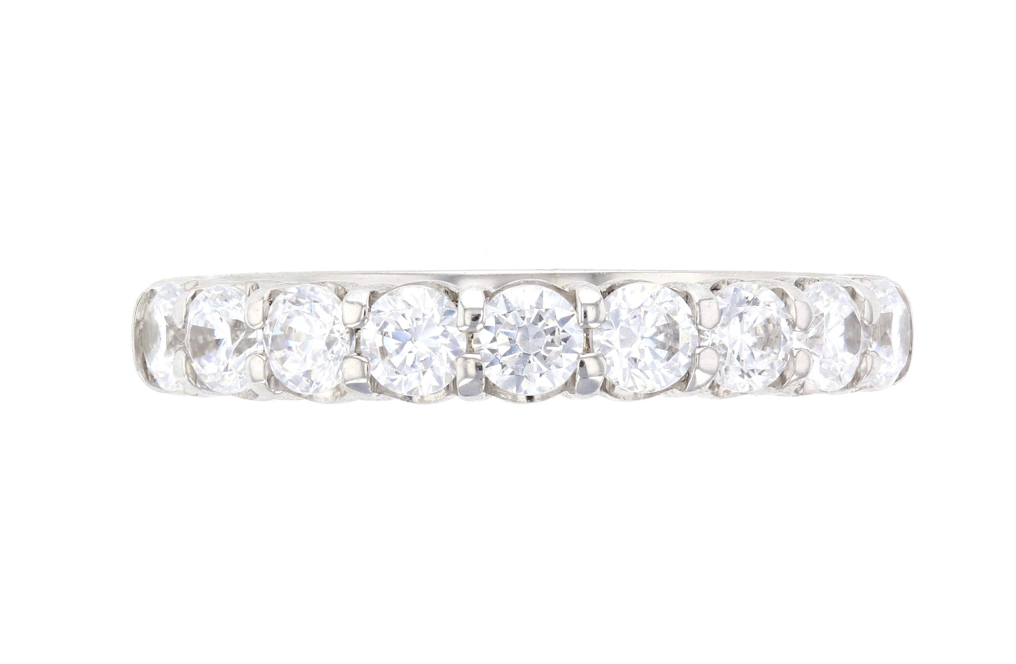 Elegant diamond eternity band in 14K white gold, featuring round brilliant diamonds set in a timeless design.