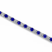 Elegant sapphire and diamond tennis bracelet in 14K gold, perfect for timeless fine jewelry lovers.