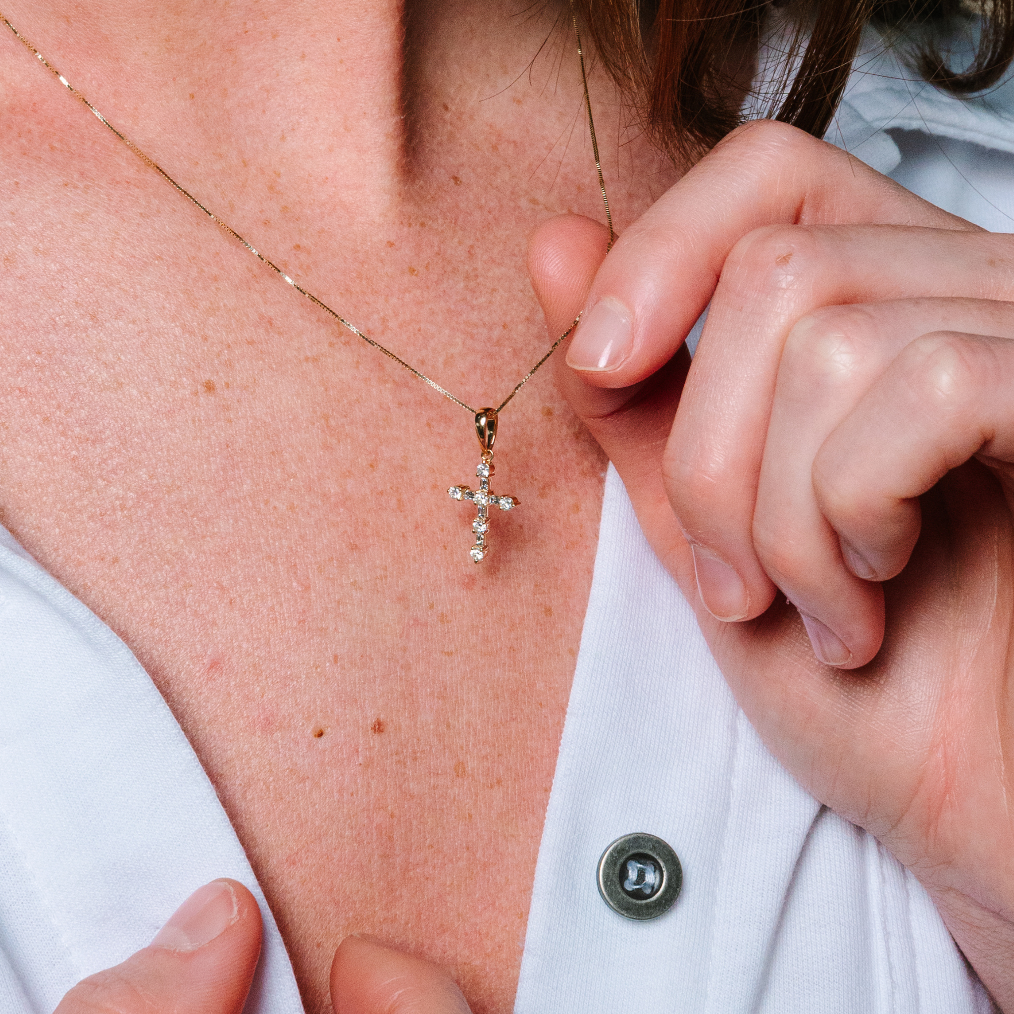 14K gold cross necklace with diamonds, worn close to skin, delicate chain, everyday fine jewelry