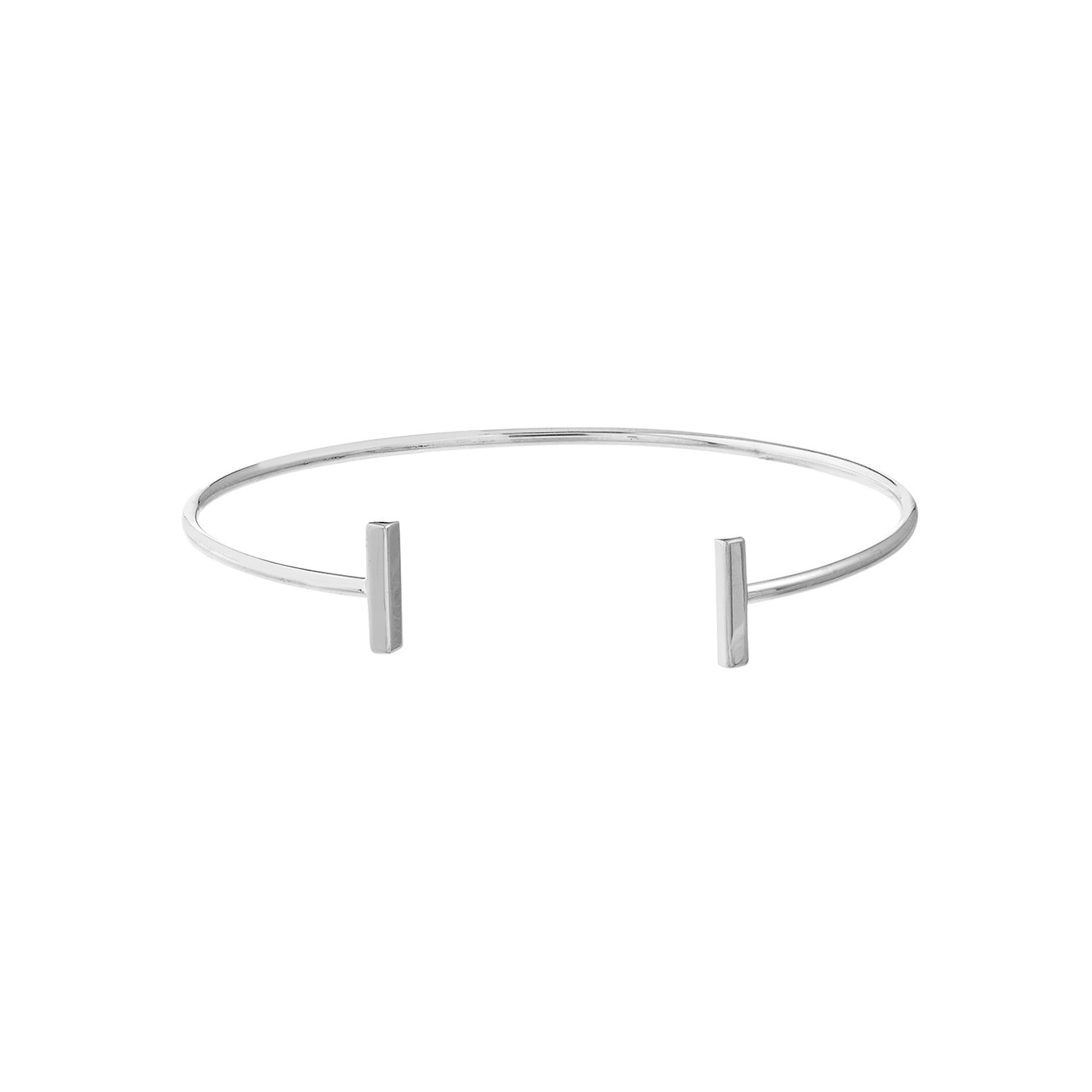 Minimalist silver cuff bracelet with sleek bar accents, fine jewelry for everyday wear