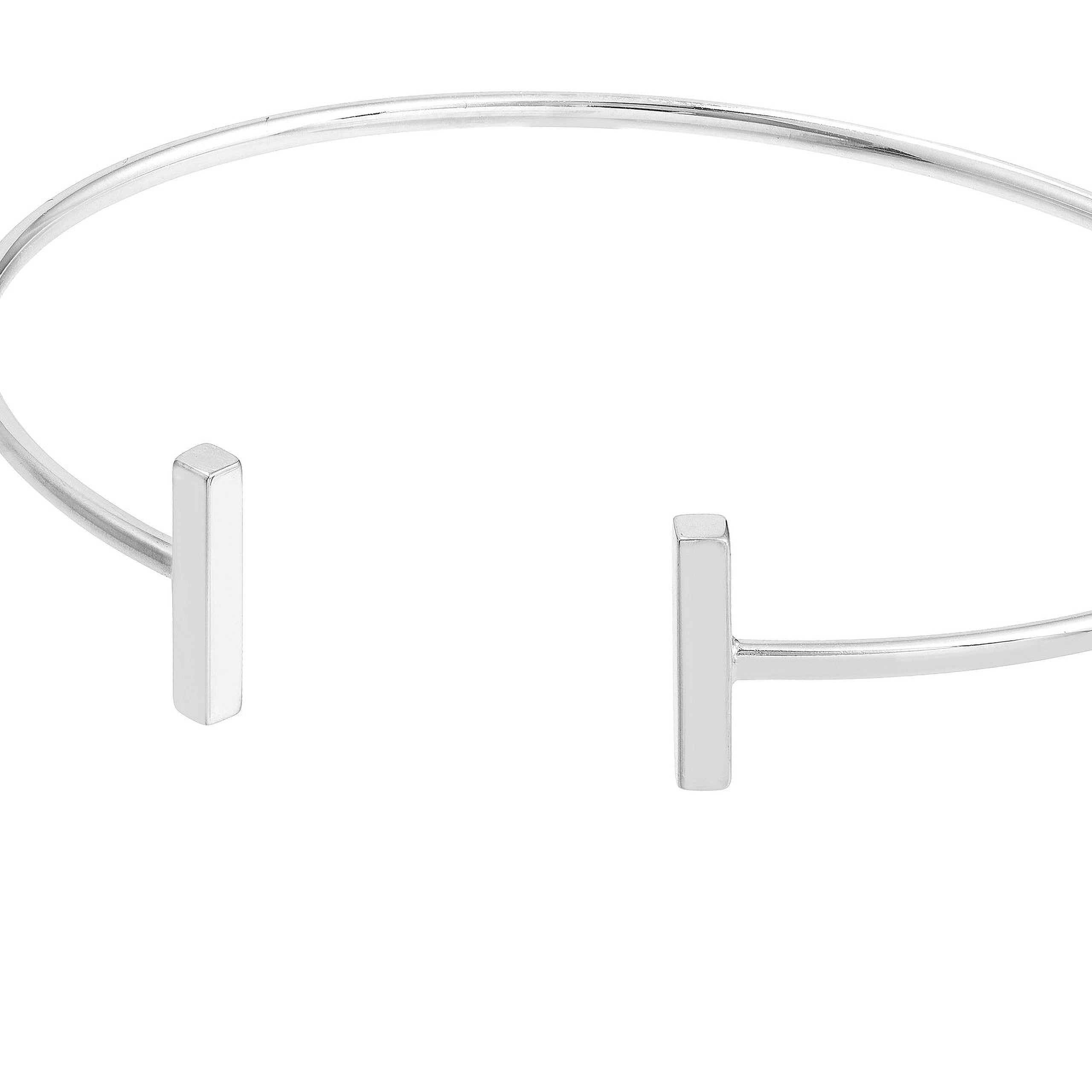 Minimalist silver bangle with sleek bar accents, fine jewelry for everyday wear