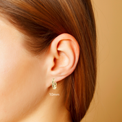 10mm gold twisted hoop earring on ear, fine jewelry for everyday wear