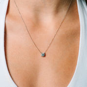 Delicate 14K gold necklace with solitaire diamond pendant, perfect for everyday wear