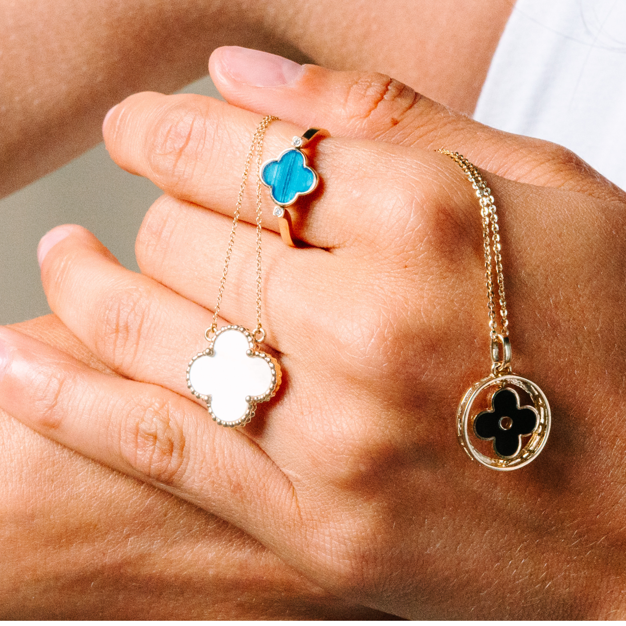 14K gold clover jewelry set with blue, white, and black enamel pendants and ring, timeless fine jewelry