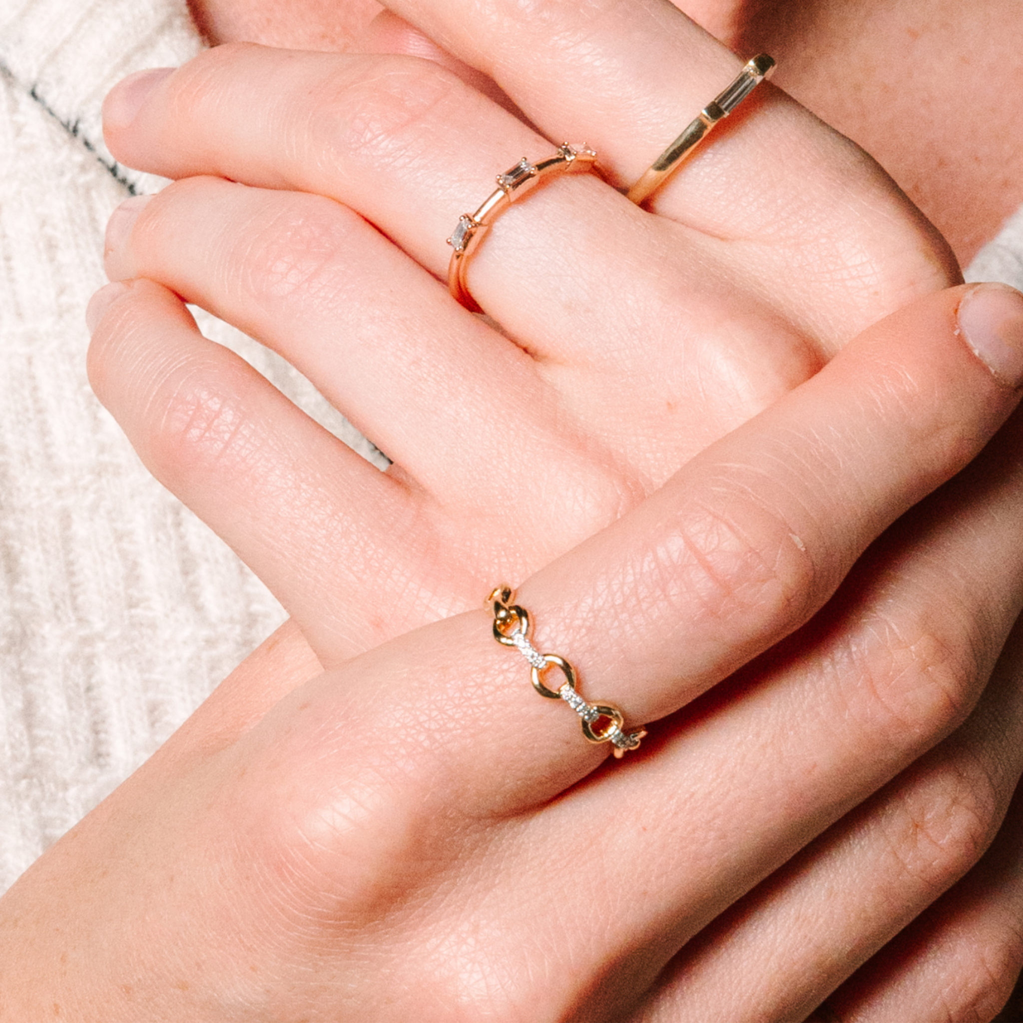 14K gold rings with diamonds, layered on hands — timeless fine jewelry for everyday wear