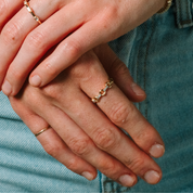 14K gold diamond link ring on hand, everyday fine jewelry styled with denim