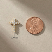 Tiny 14K gold cross pendant with diamonds, 0.50" tall, shown beside penny for scale