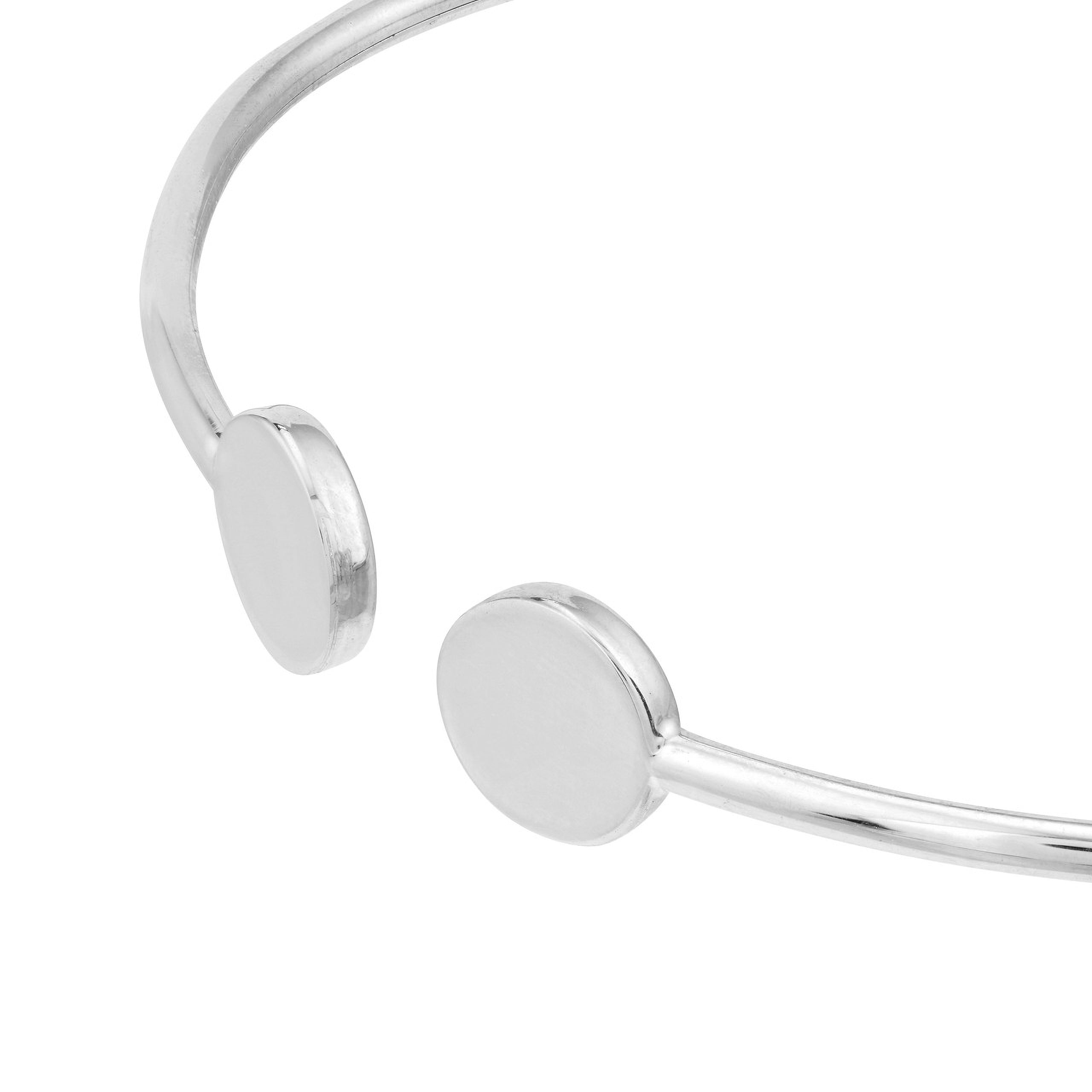 Minimalist silver cuff bracelet with smooth disc details, timeless fine jewelry for everyday wear