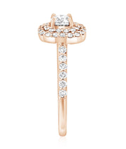 Rose gold diamond engagement ring with halo and channel-set side stones, timeless fine jewelry