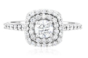 Elegant diamond halo engagement ring in 14K white gold with round center stone and pave band