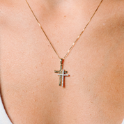 14K gold cross necklace with diamond accents, delicate chain worn on skin