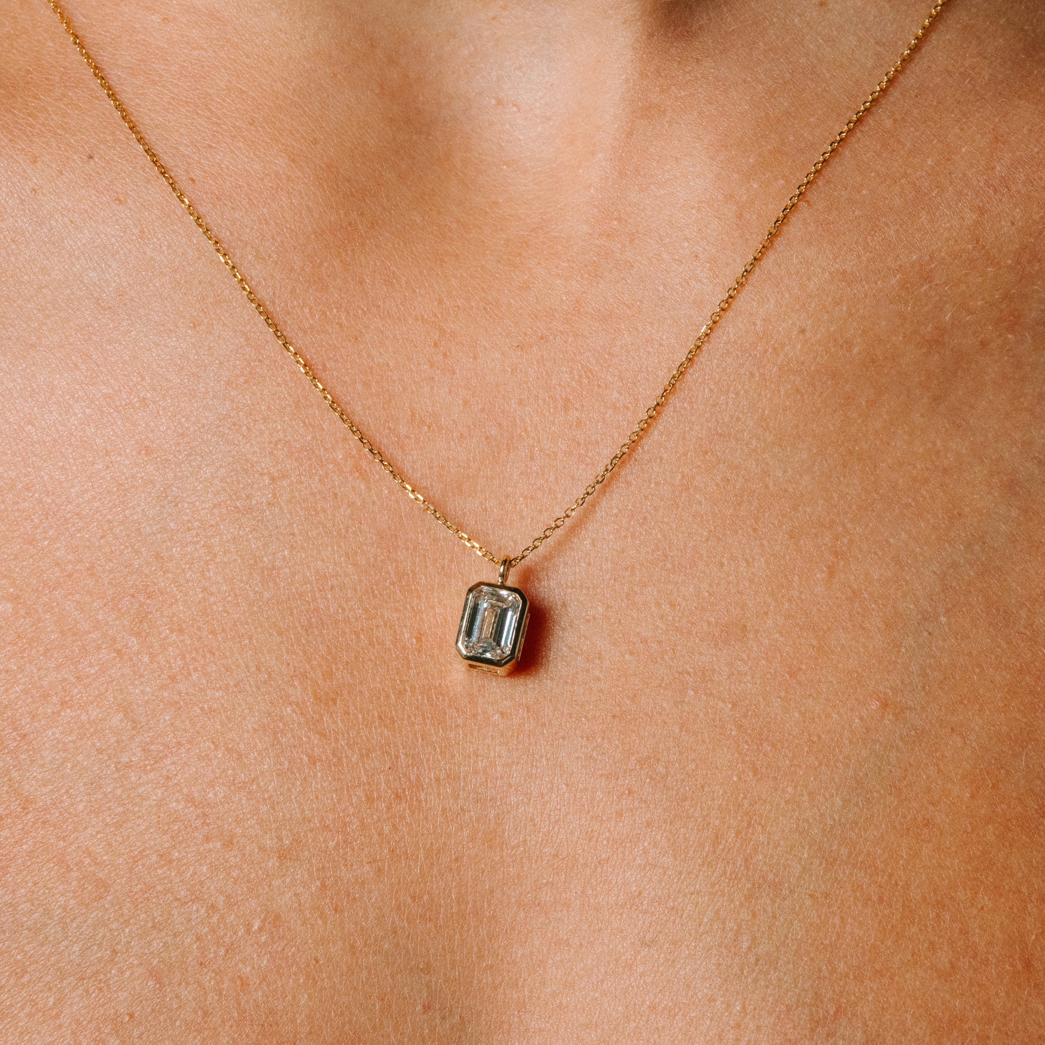 14K gold necklace with emerald cut diamond pendant, timeless fine jewelry for everyday wear