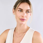 Woman wearing 14K gold paperclip chain necklace, timeless fine jewelry for everyday wear