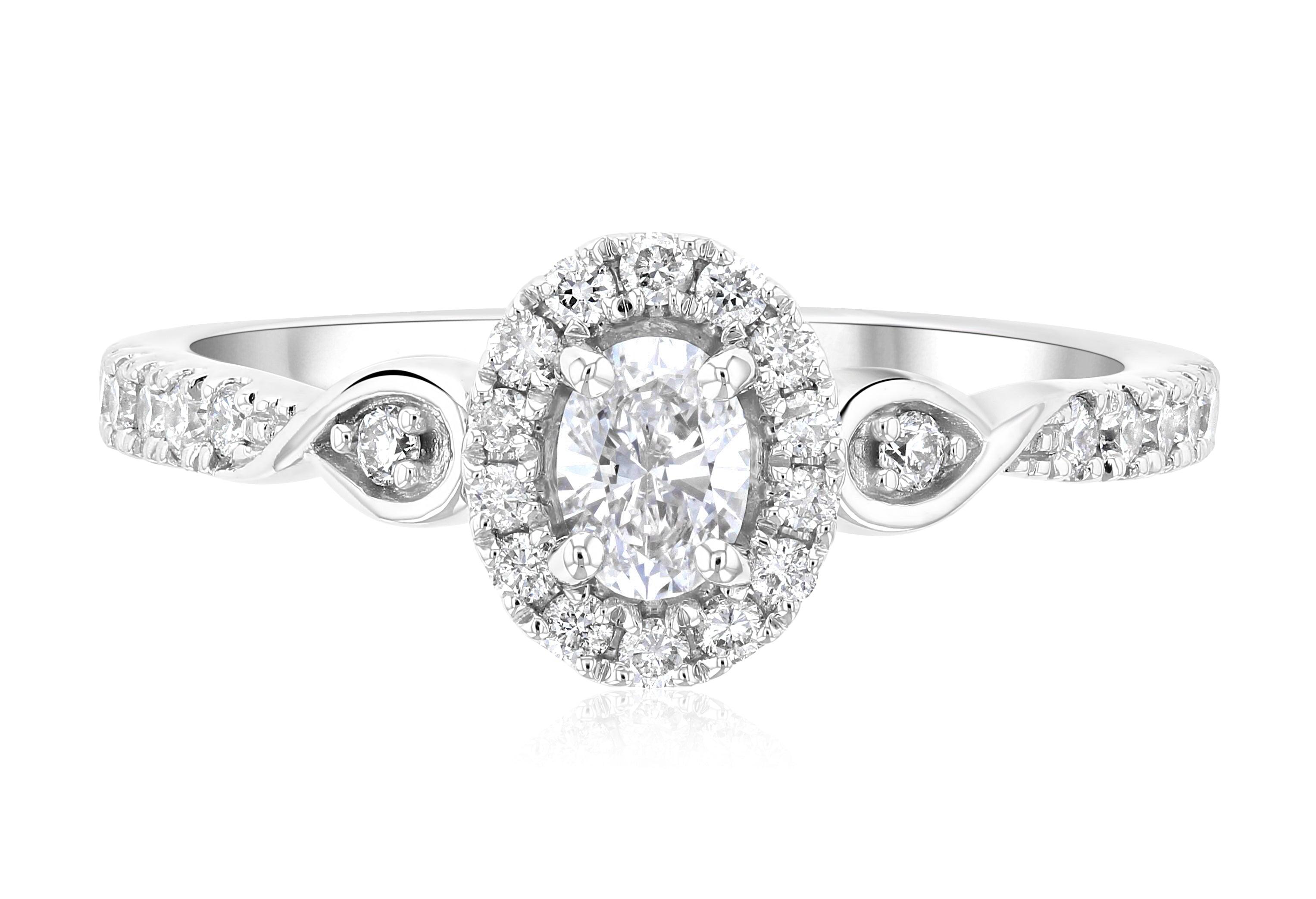 Oval diamond halo engagement ring in 14K white gold with side accents and twisted band
