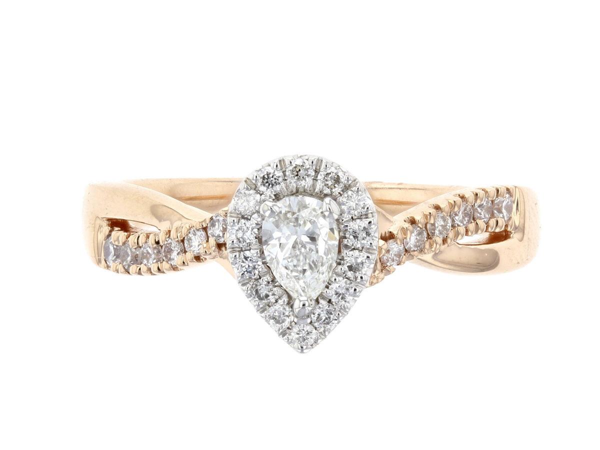 Pear diamond engagement ring in 14K rose gold with halo and twisted band, timeless fine jewelry