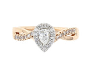 Pear diamond engagement ring in 14K rose gold with halo and twisted band, timeless fine jewelry