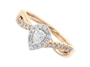 Pear-shaped diamond halo ring in 14K rose gold with pavé band, timeless fine jewelry