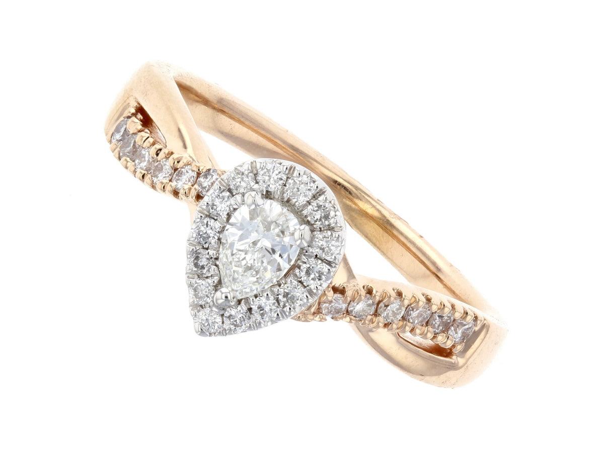 Pear-shaped diamond halo ring in 14K rose gold with pavé band, timeless fine jewelry