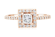 Princess cut diamond engagement ring in 14K rose gold with halo and pavé band
