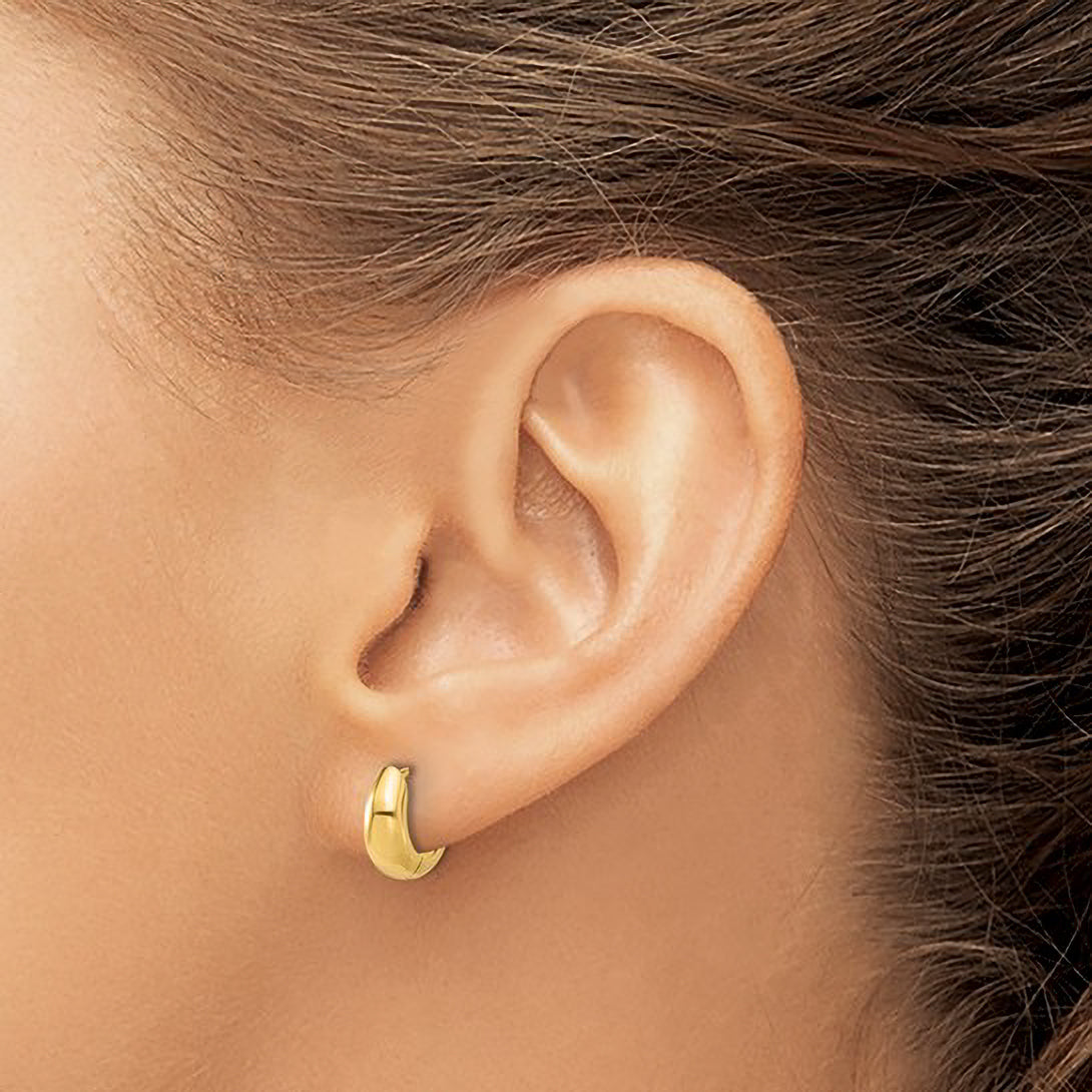 14K gold huggie hoop earring on ear, minimalist fine jewelry for everyday wear