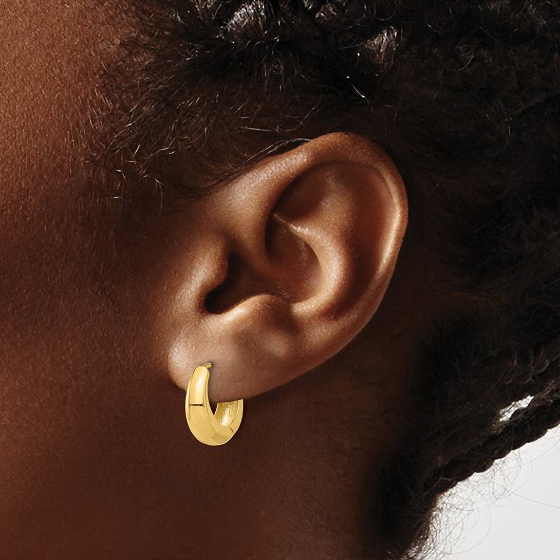14K gold huggie hoop earring worn on ear, timeless fine jewelry for everyday wear
