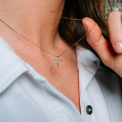 14K gold diamond cross necklace on woman, delicate chain, everyday fine jewelry
