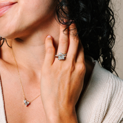 Woman wearing 14K gold diamond ring and matching necklace, elegant fine jewelry for everyday wear
