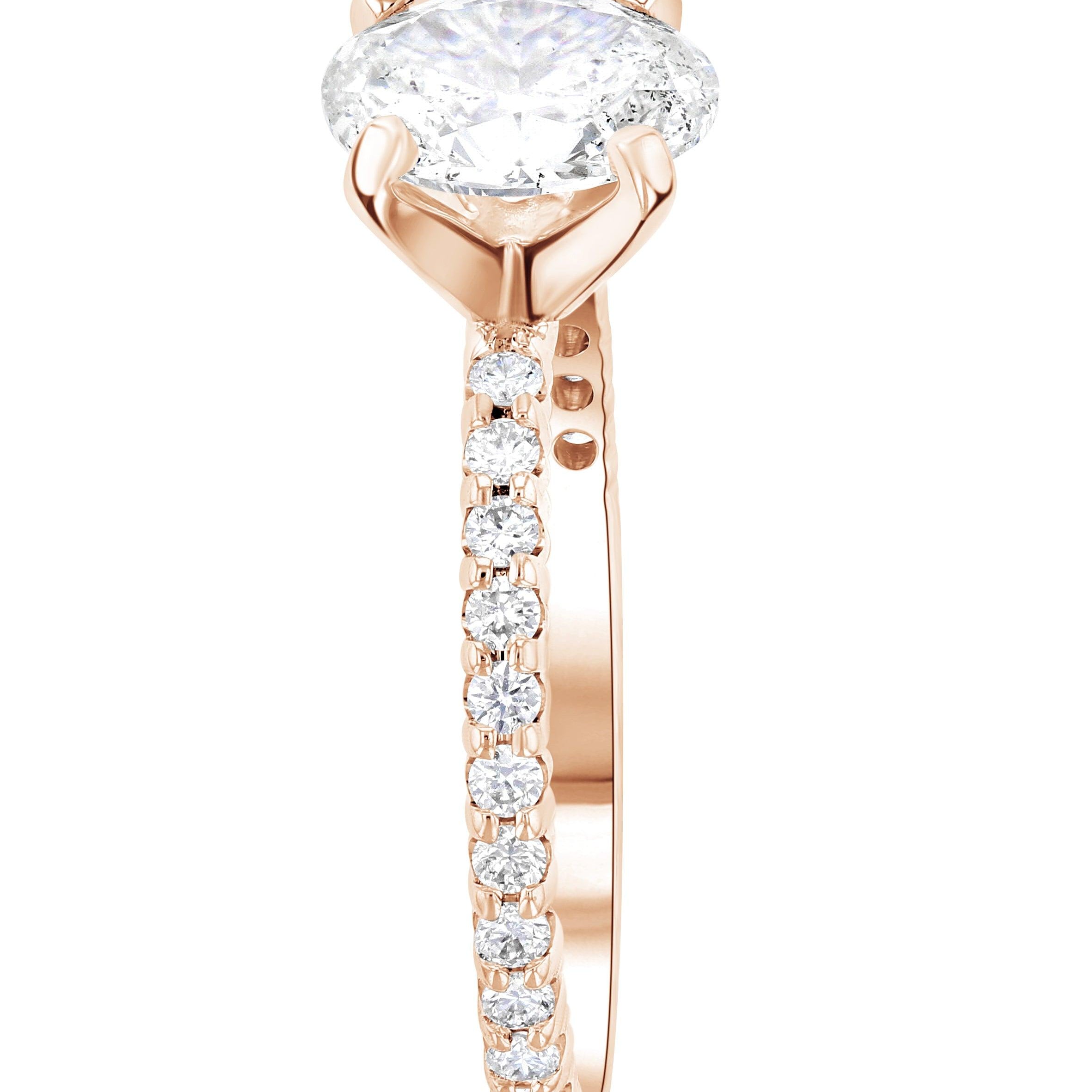 Oval diamond engagement ring in 14K rose gold with side diamonds, timeless fine jewelry