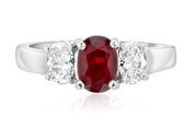 Elegant 14K gold ring with oval ruby center and diamond accents, timeless fine jewelry