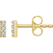 14K gold diamond stud earrings with three round diamonds in a vertical bar design