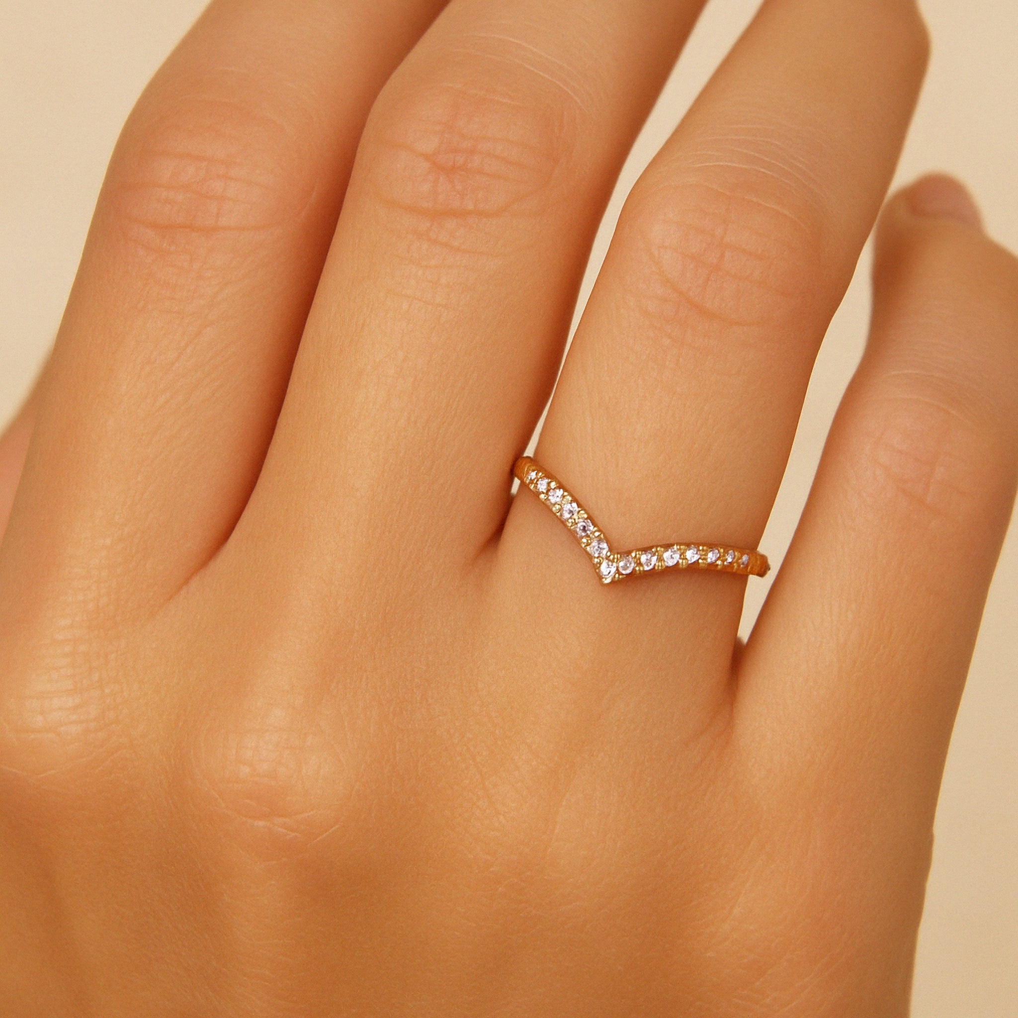 14K gold V-shaped diamond ring on finger, timeless fine jewelry for everyday wear