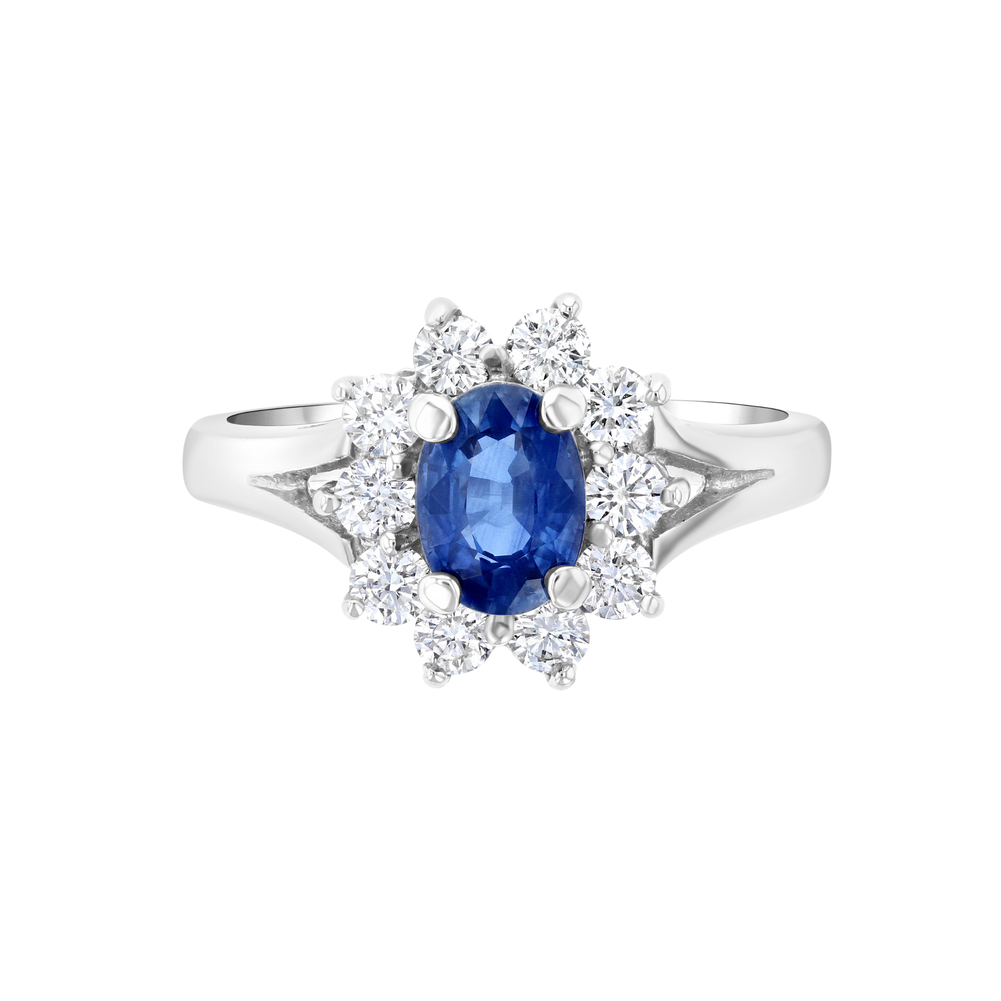 Elegant sapphire and diamond ring in 14K white gold, featuring oval blue sapphire center with halo of round diamonds.