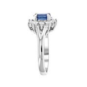 Elegant sapphire and diamond ring in 14K white gold, featuring a cushion-cut blue sapphire center with halo accents.