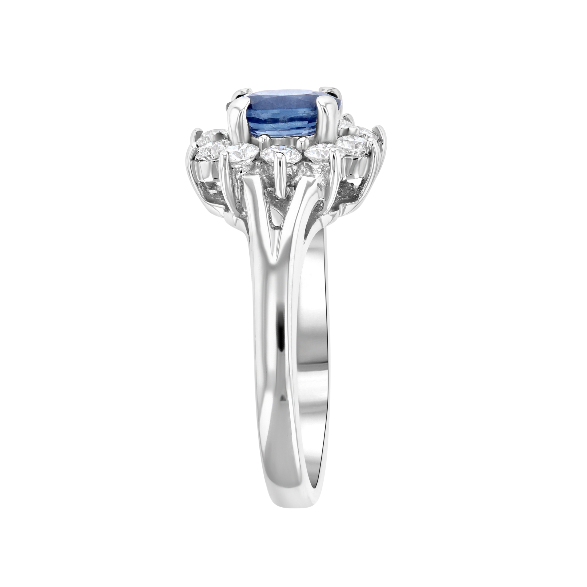 Elegant sapphire and diamond ring in 14K white gold, featuring a cushion-cut blue sapphire center with halo accents.