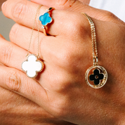14K gold clover pendant necklaces and ring with turquoise, white, and black enamel details