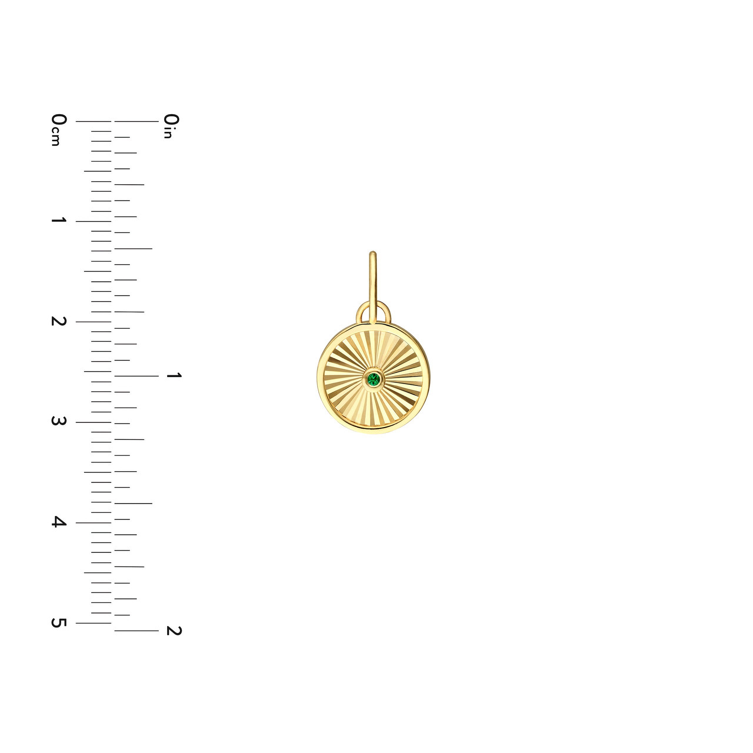 14K gold pendant with sunburst design and green gemstone, shown with size ruler for scale