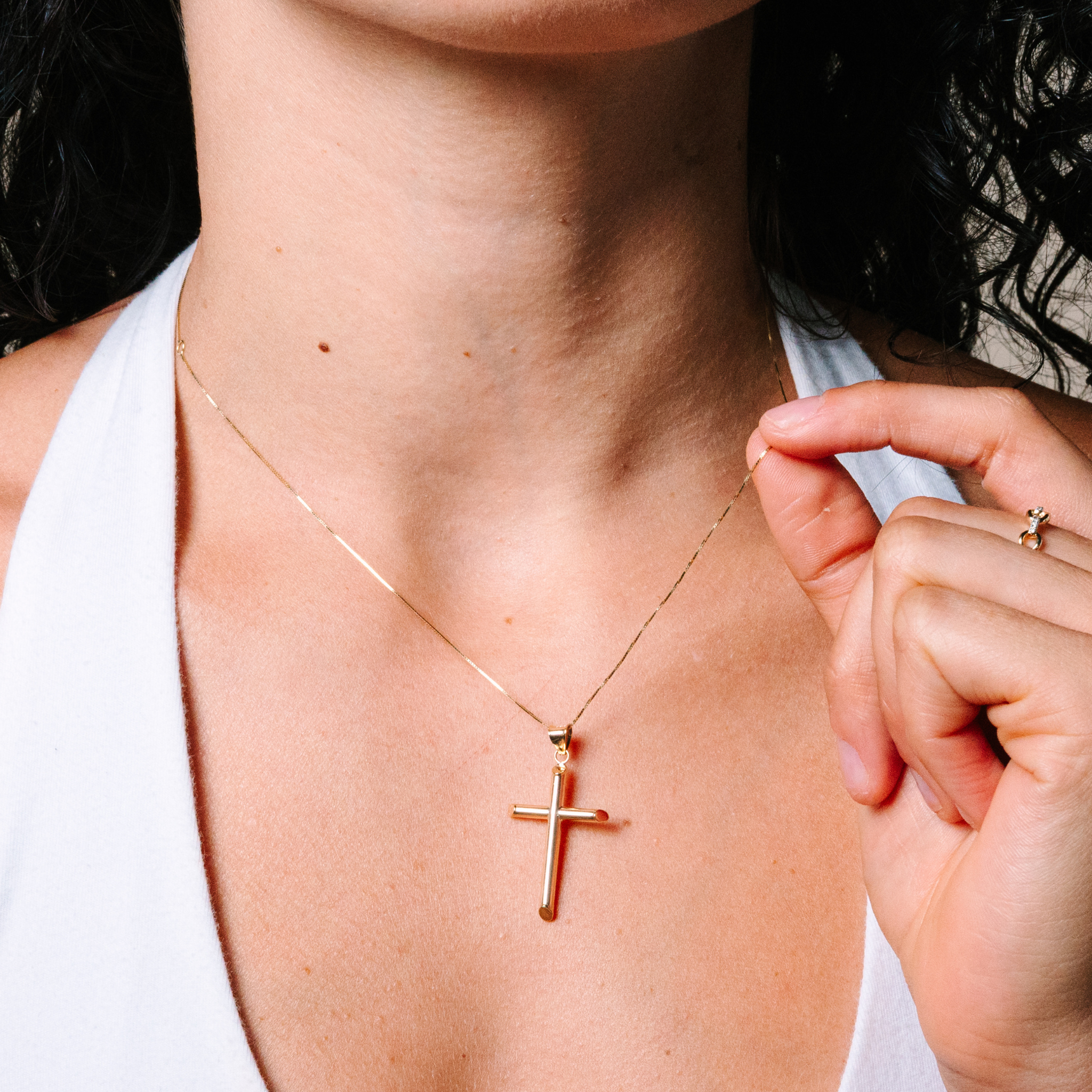 14K gold cross necklace on woman, delicate chain with minimalist pendant, everyday fine jewelry