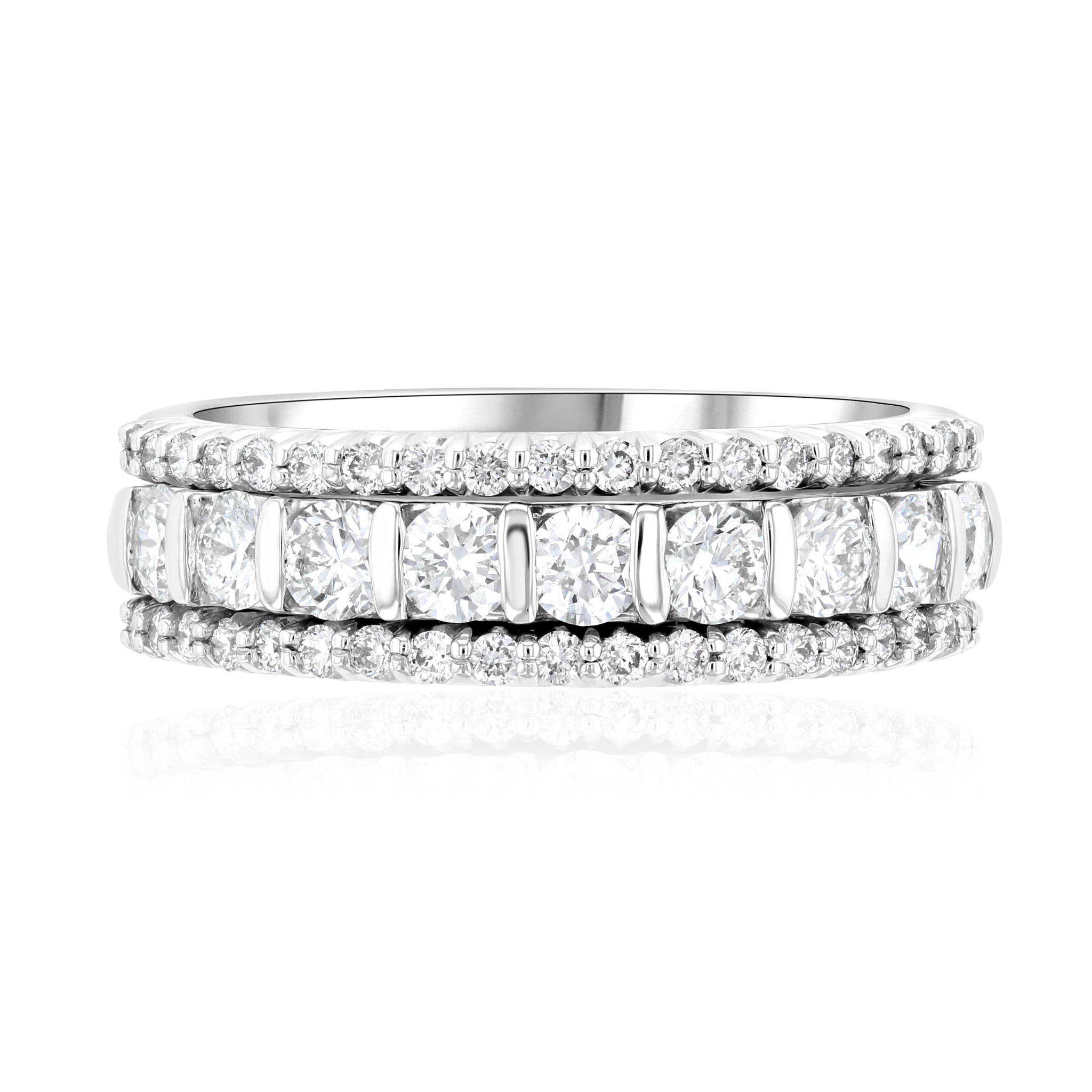 Three 14K white gold diamond bands stacked, featuring round brilliant and channel-set diamonds for timeless elegance.