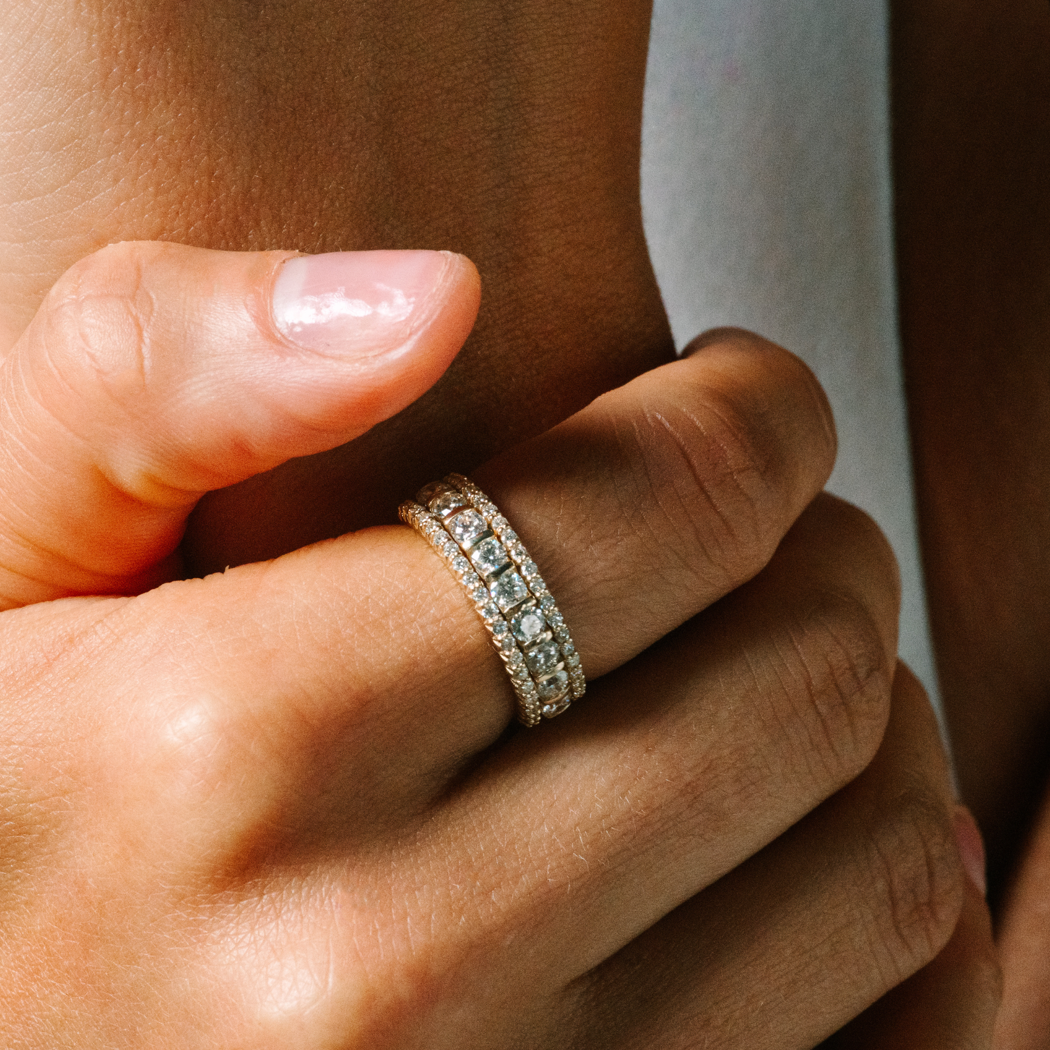 Elegant 14K gold diamond stackable rings on a hand, perfect for everyday wear and timeless style.