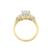 14K gold three-stone diamond engagement ring with round center and pear side stones