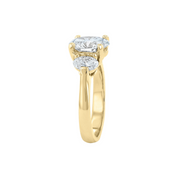 14K yellow gold engagement ring with oval diamond center and side stones, timeless fine jewelry