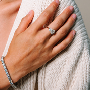 Elegant diamond ring and bracelet on hand, showcasing timeless fine jewelry in 14K gold for everyday wear.
