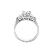 Elegant 14K gold three-stone diamond engagement ring with round center and trillion side stones