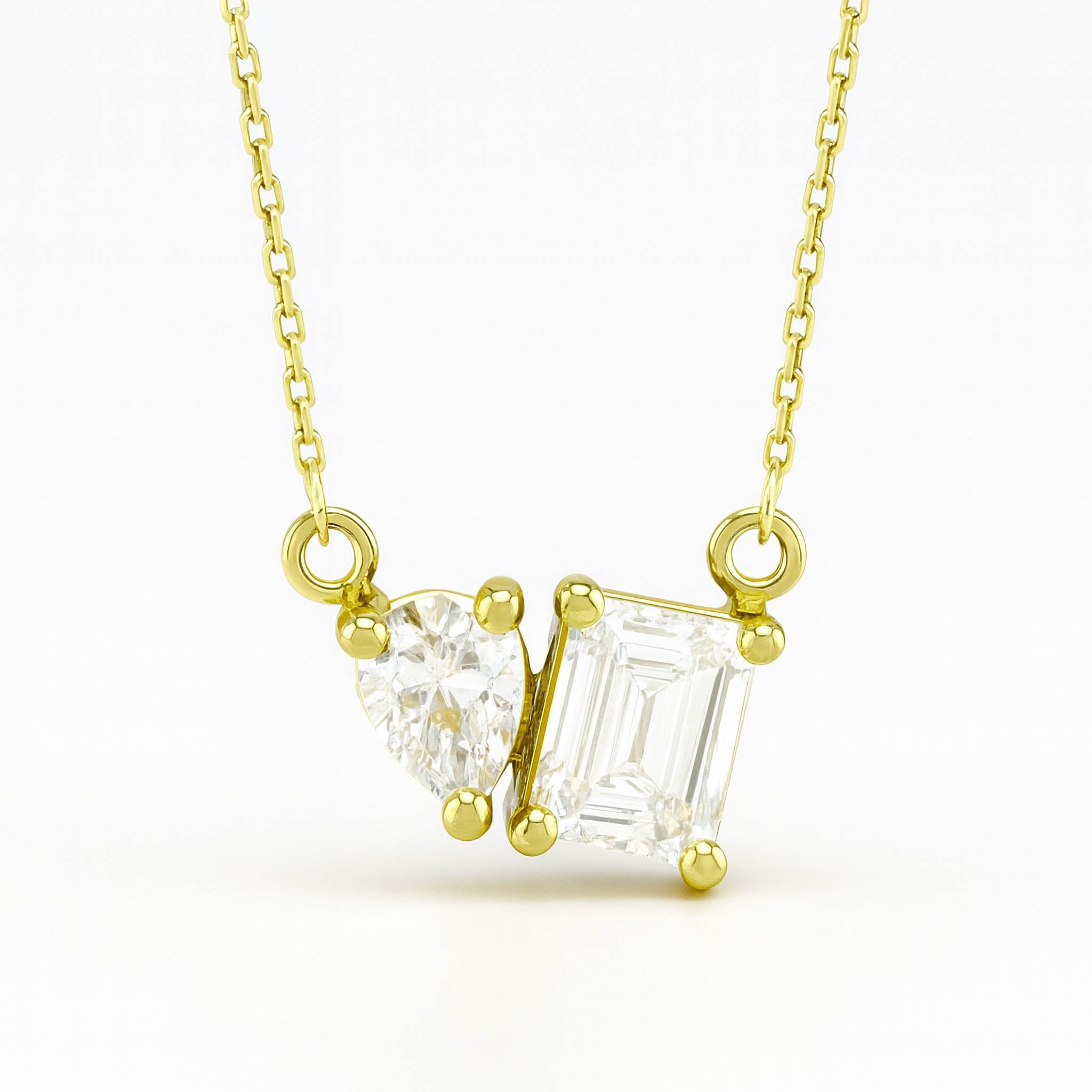 14K gold necklace with heart and emerald cut diamond pendant, timeless fine jewelry