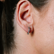 Diamond hoop earring in 14K gold, worn on earlobe, timeless fine jewelry for everyday wear