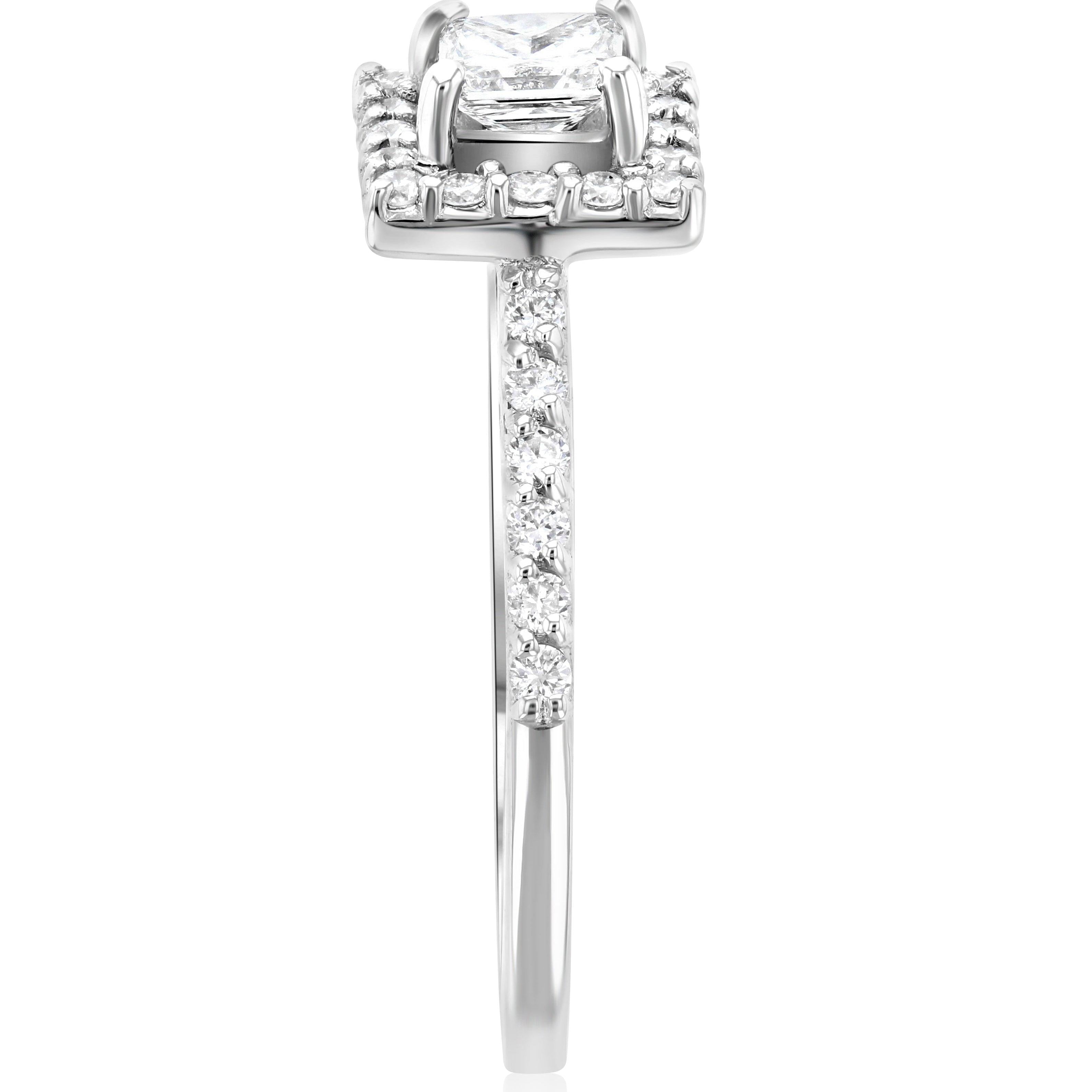 Elegant diamond engagement ring with cushion cut center stone, halo, and pavé band in 14K white gold